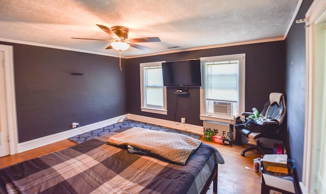 500 W Chicago St, Coldwater, MI 49036 - bedroom with a textured ceiling, ornamental molding, wood finished floors, cooling unit, and a ceiling fan