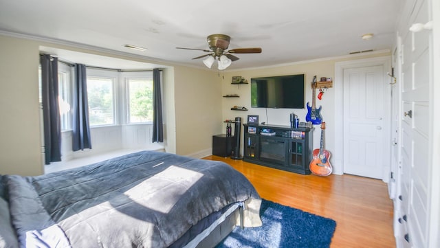 500 W Chicago St, Coldwater, MI 49036 - bedroom featuring crown molding, wood finished floors, and a ceiling fan