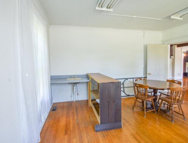 500 W Chicago St, Coldwater, MI 49036 - dining space with wood finished floors and crown molding