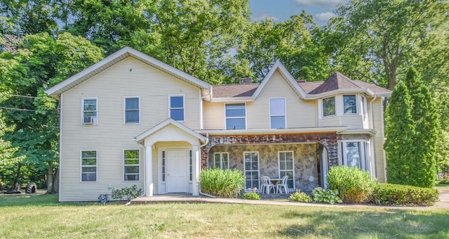 500 W Chicago St, Coldwater, MI 49036 - view of front facade with a front yard, covered porch, and stone siding