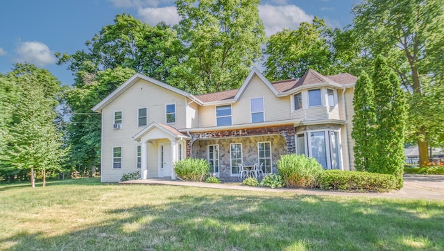 500 W Chicago St, Coldwater, MI 49036 - view of front of home with stone siding and a front lawn