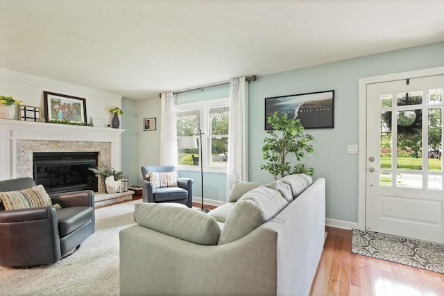 516 Zehnder Dr, Frankenmuth, MI 48734 - living area featuring wood-type flooring and a stone fireplace