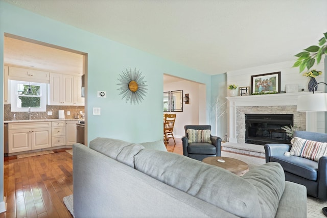 516 Zehnder Dr, Frankenmuth, MI 48734 - living room with light wood-style flooring and a stone fireplace