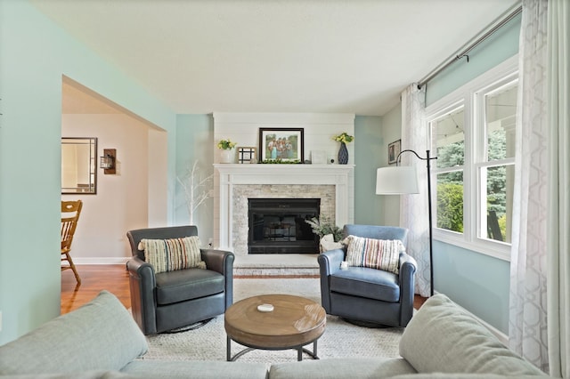 516 Zehnder Dr, Frankenmuth, MI 48734 - living area with wood finished floors and a stone fireplace