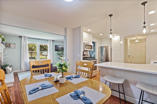516 Zehnder Dr, Frankenmuth, MI 48734 - dining area with light wood-type flooring and recessed lighting