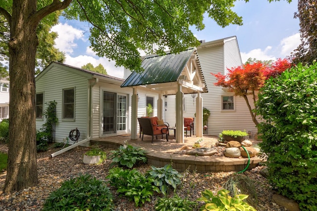 516 Zehnder Dr, Frankenmuth, MI 48734 - back of house featuring a patio