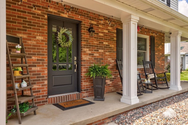 516 Zehnder Dr, Frankenmuth, MI 48734 - entrance to property with covered porch and brick siding