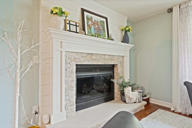 516 Zehnder Dr, Frankenmuth, MI 48734 - detailed view of a glass covered fireplace and wood finished floors