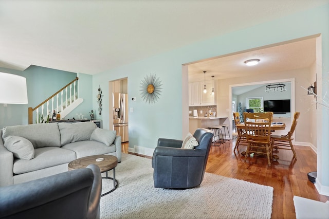 516 Zehnder Dr, Frankenmuth, MI 48734 - living room with stairs and light wood-style floors