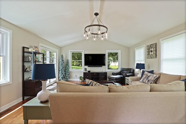 516 Zehnder Dr, Frankenmuth, MI 48734 - living area with light wood-style flooring, a chandelier, and lofted ceiling
