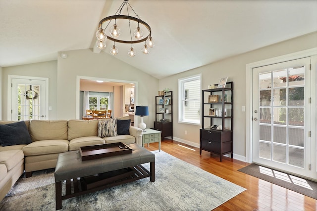 516 Zehnder Dr, Frankenmuth, MI 48734 - living area with wood finished floors, healthy amount of natural light, and a chandelier