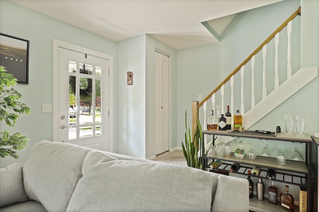 516 Zehnder Dr, Frankenmuth, MI 48734 - living area featuring a dry bar and stairway