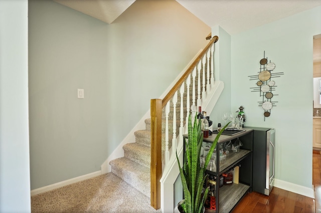 516 Zehnder Dr, Frankenmuth, MI 48734 - stairs featuring baseboards and wood finished floors