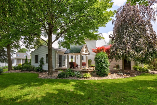 516 Zehnder Dr, Frankenmuth, MI 48734 - back of property with a lawn and a patio area