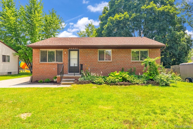 35057 Markey St, Westland, MI 48186 - view of front of home with brick siding and a front lawn