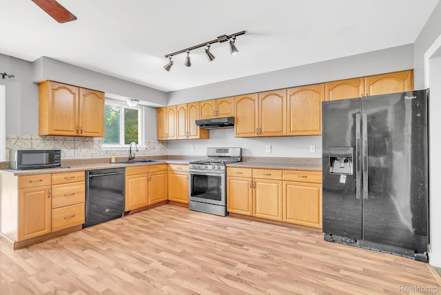35057 Markey St, Westland, MI 48186 - kitchen with black appliances, under cabinet range hood, light wood-style floors, and light brown cabinets