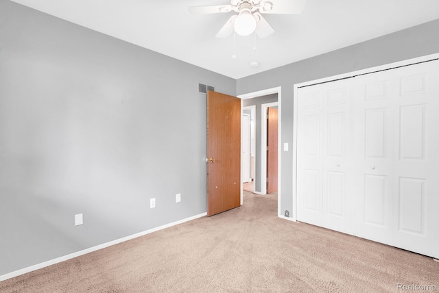 35057 Markey St, Westland, MI 48186 - unfurnished bedroom with light carpet, a closet, and a ceiling fan