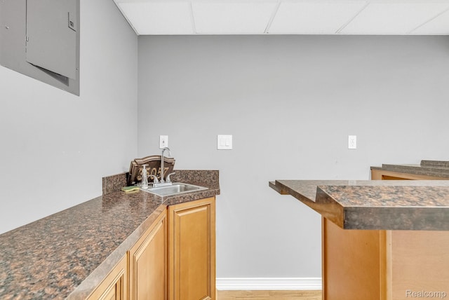 35057 Markey St, Westland, MI 48186 - indoor wet bar featuring electric panel, a paneled ceiling, and light wood-style floors