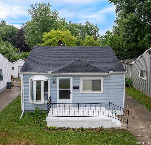 27700 Dartmouth St, Troy, MI 48071 - bungalow-style house featuring a shingled roof and a chimney