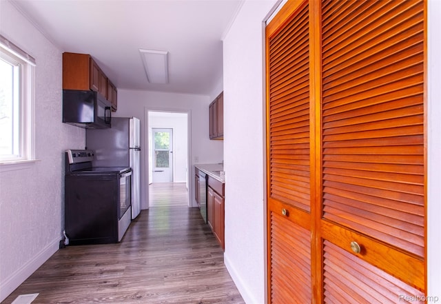27700 Dartmouth St, Troy, MI 48071 - kitchen featuring stainless steel appliances, dark wood-style floors, light countertops, and a textured wall