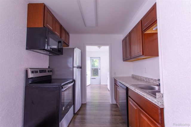 27700 Dartmouth St, Troy, MI 48071 - kitchen with stainless steel electric stove, black microwave, dishwasher, dark wood finished floors, and light countertops
