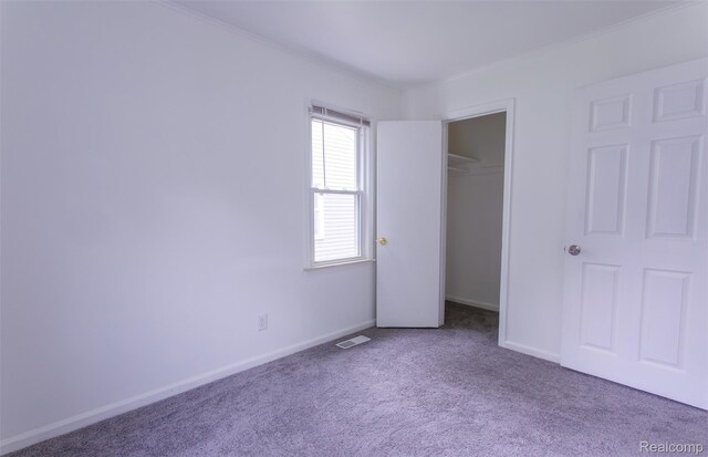 27700 Dartmouth St, Troy, MI 48071 - unfurnished bedroom with carpet, ornamental molding, and a closet