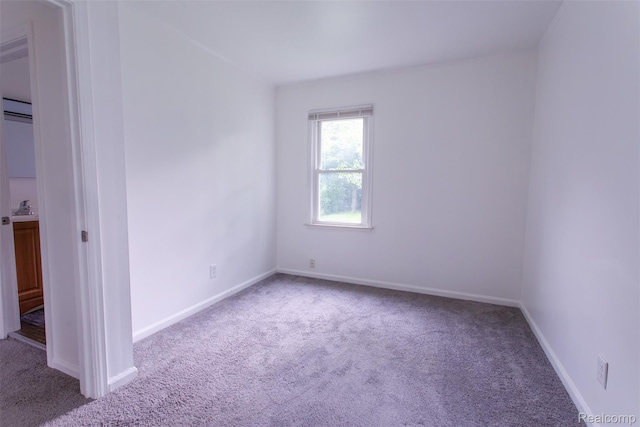 27700 Dartmouth St, Troy, MI 48071 - carpeted empty room with baseboards and a sink