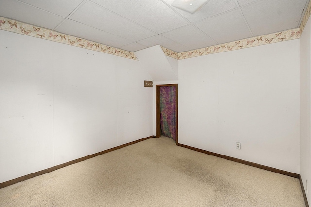 7035 W Filmore Rd, Mears, MI 49436 - unfurnished room featuring a drop ceiling and light carpet