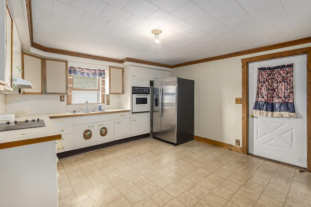 7035 W Filmore Rd, Mears, MI 49436 - kitchen featuring stainless steel fridge with ice dispenser, oven, black electric cooktop, light countertops, and light flooring