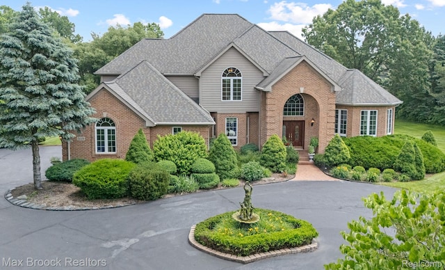 519 Hawksmoore Dr, Clarkston, MI 48348 - traditional home with brick siding and a shingled roof