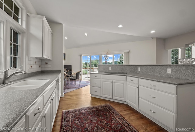 519 Hawksmoore Dr, Clarkston, MI 48348 - kitchen featuring dark wood finished floors, white cabinets, decorative backsplash, a chandelier, and recessed lighting