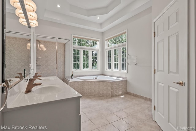 519 Hawksmoore Dr, Clarkston, MI 48348 - full bathroom with a bath, double vanity, tile patterned floors, a shower stall, and a raised ceiling