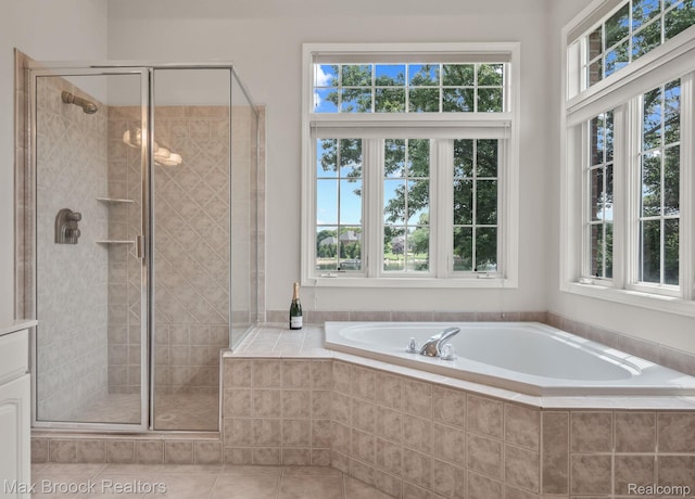 519 Hawksmoore Dr, Clarkston, MI 48348 - full bathroom with a bath, a shower stall, and tile patterned floors