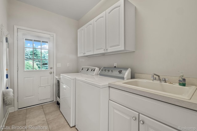 519 Hawksmoore Dr, Clarkston, MI 48348 - laundry room with cabinet space, independent washer and dryer, and light tile patterned flooring