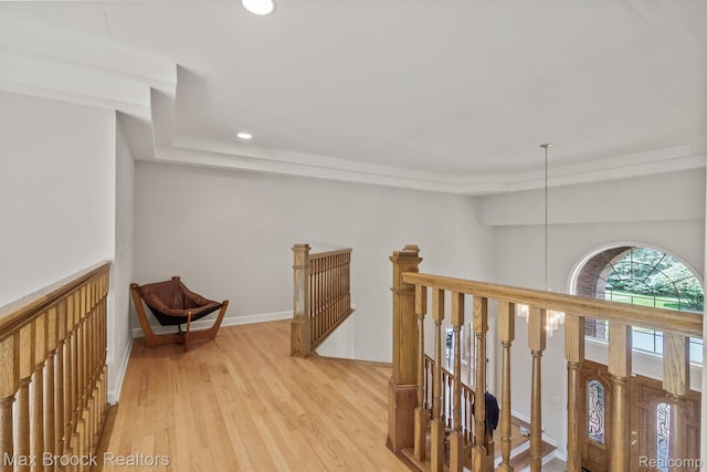519 Hawksmoore Dr, Clarkston, MI 48348 - hall with an upstairs landing, recessed lighting, light wood-style floors, and a raised ceiling