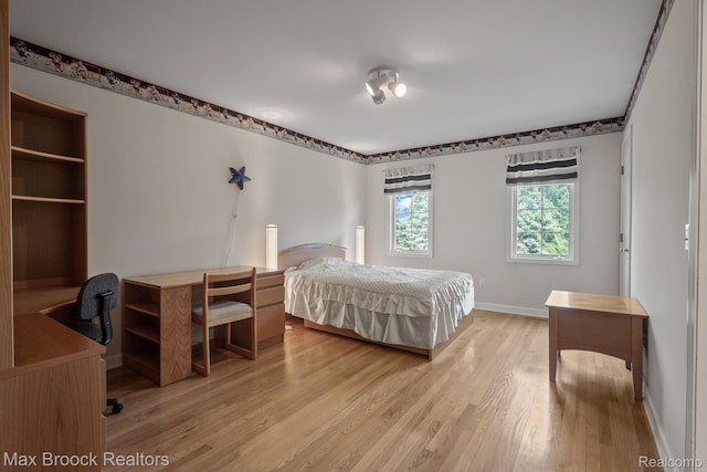 519 Hawksmoore Dr, Clarkston, MI 48348 - bedroom featuring light wood-type flooring and an office area