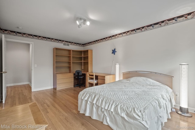 519 Hawksmoore Dr, Clarkston, MI 48348 - bedroom with wood finished floors and built in study area