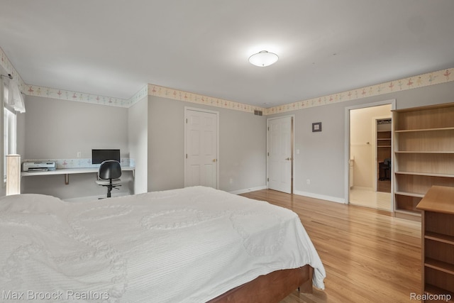 519 Hawksmoore Dr, Clarkston, MI 48348 - bedroom featuring wood finished floors and a desk