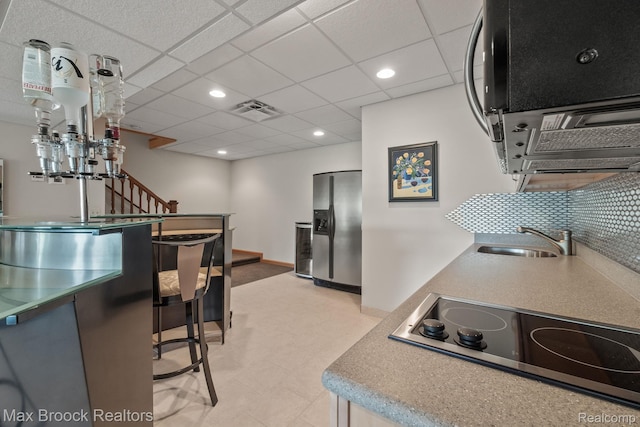 519 Hawksmoore Dr, Clarkston, MI 48348 - kitchen featuring stainless steel fridge with ice dispenser, black electric cooktop, light floors, and recessed lighting