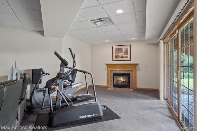 519 Hawksmoore Dr, Clarkston, MI 48348 - workout room with a drop ceiling, carpet flooring, and a fireplace with flush hearth
