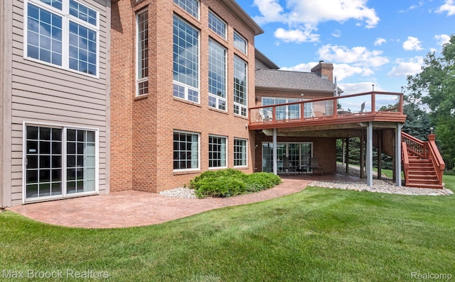 519 Hawksmoore Dr, Clarkston, MI 48348 - back of property featuring a patio, a yard, a wooden deck, and stairway