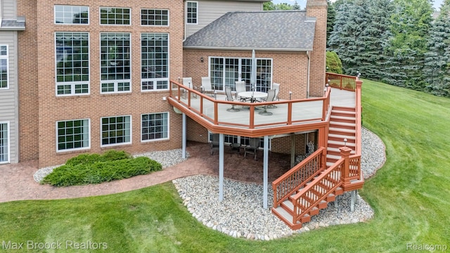 519 Hawksmoore Dr, Clarkston, MI 48348 - rear view of house featuring stairs, a chimney, a lawn, brick siding, and roof with shingles