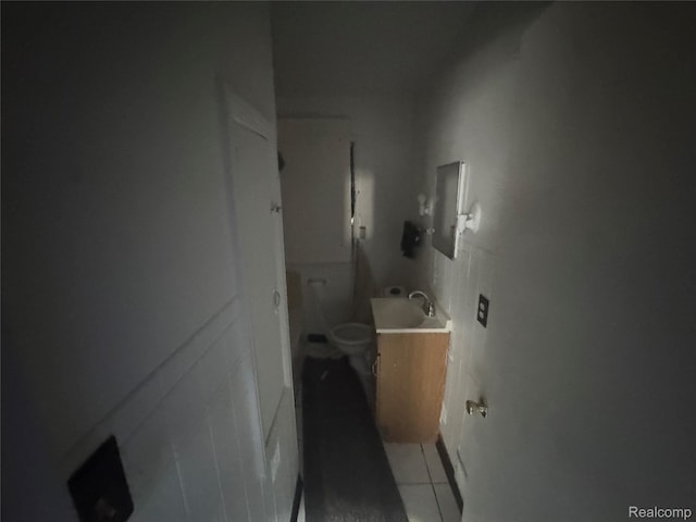 17416 Bentler St, Detroit, MI 48219 - bathroom with vanity, tile patterned flooring, and tile walls