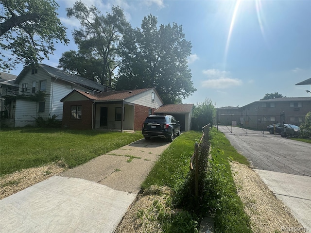 17416 Bentler St, Detroit, MI 48219 - view of property exterior featuring driveway and brick siding