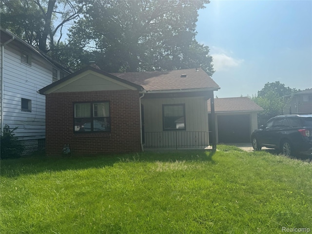 17416 Bentler St, Detroit, MI 48219 - bungalow featuring brick siding, a front yard, roof with shingles, and covered porch