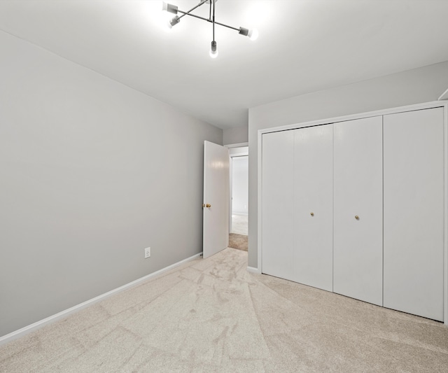 2418 Meadowridge Ct, Ann Arbor, MI 48105 - unfurnished bedroom with carpet and a closet