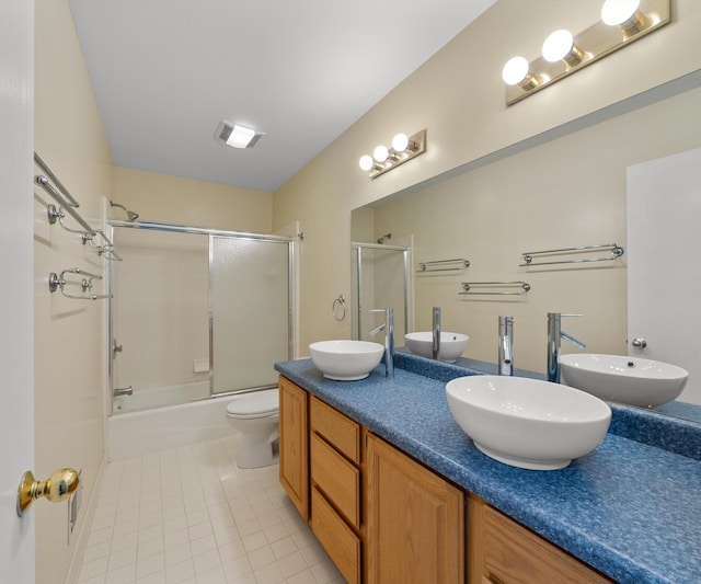 2418 Meadowridge Ct, Ann Arbor, MI 48105 - full bath featuring tile patterned flooring, bath / shower combo with glass door, and double vanity