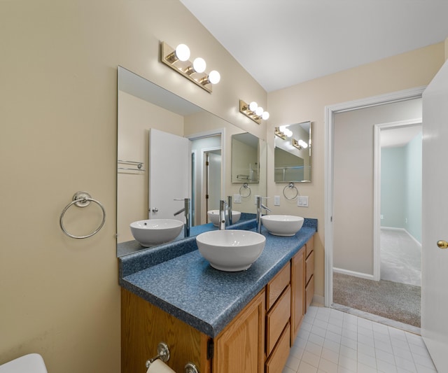 2418 Meadowridge Ct, Ann Arbor, MI 48105 - bathroom featuring double vanity and tile patterned flooring