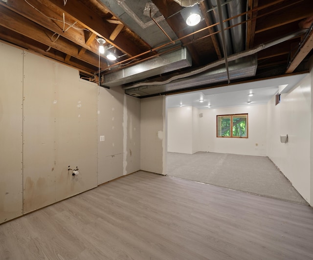 2418 Meadowridge Ct, Ann Arbor, MI 48105 - basement featuring wood finished floors