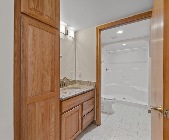 2418 Meadowridge Ct, Ann Arbor, MI 48105 - bathroom featuring vanity, tile patterned flooring, and a shower